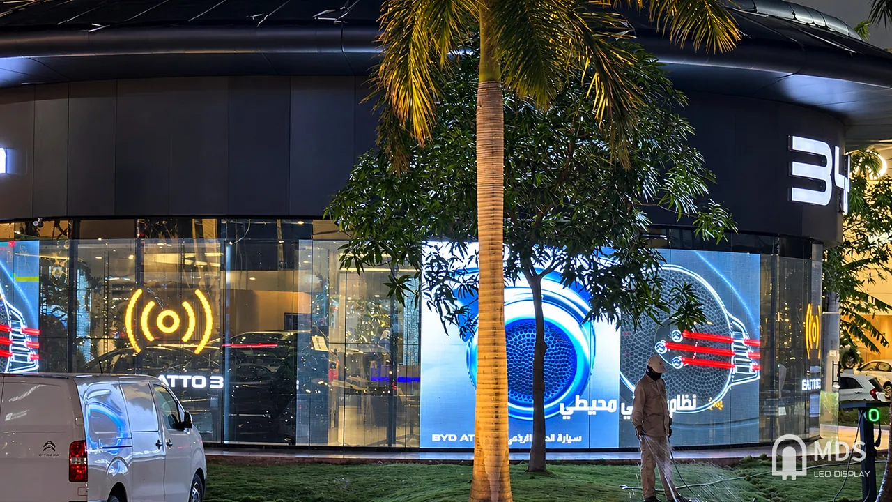 Front view of the curved MDS transparent LED window display on the BYD showroom glazing in Jeddah