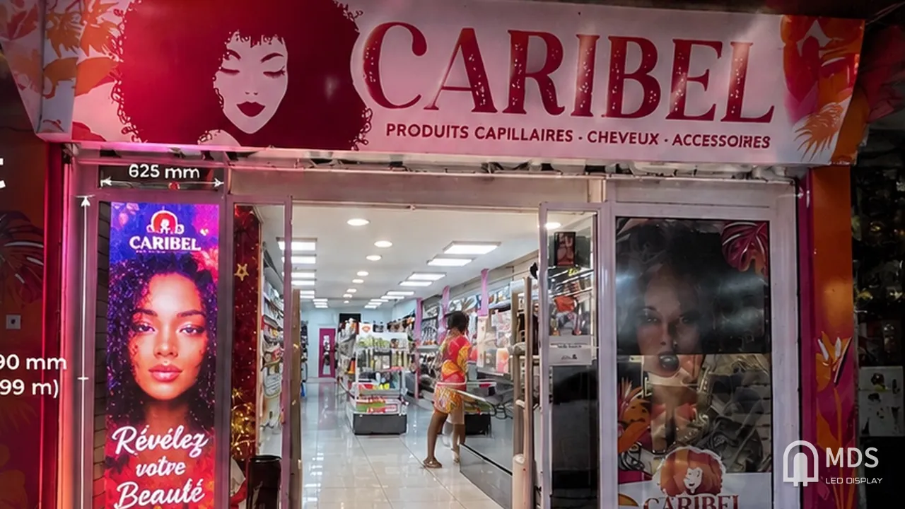 MDS transparent LED display at the entrance of the Caribel beauty store, Réunion Island, France