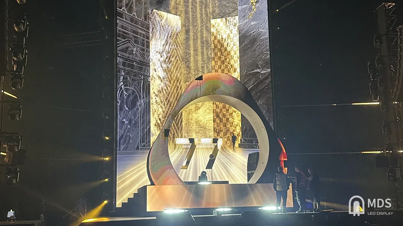 IQOS event stage: MDS curved creative LED ring and LED backdrop during rehearsal with stage lighting