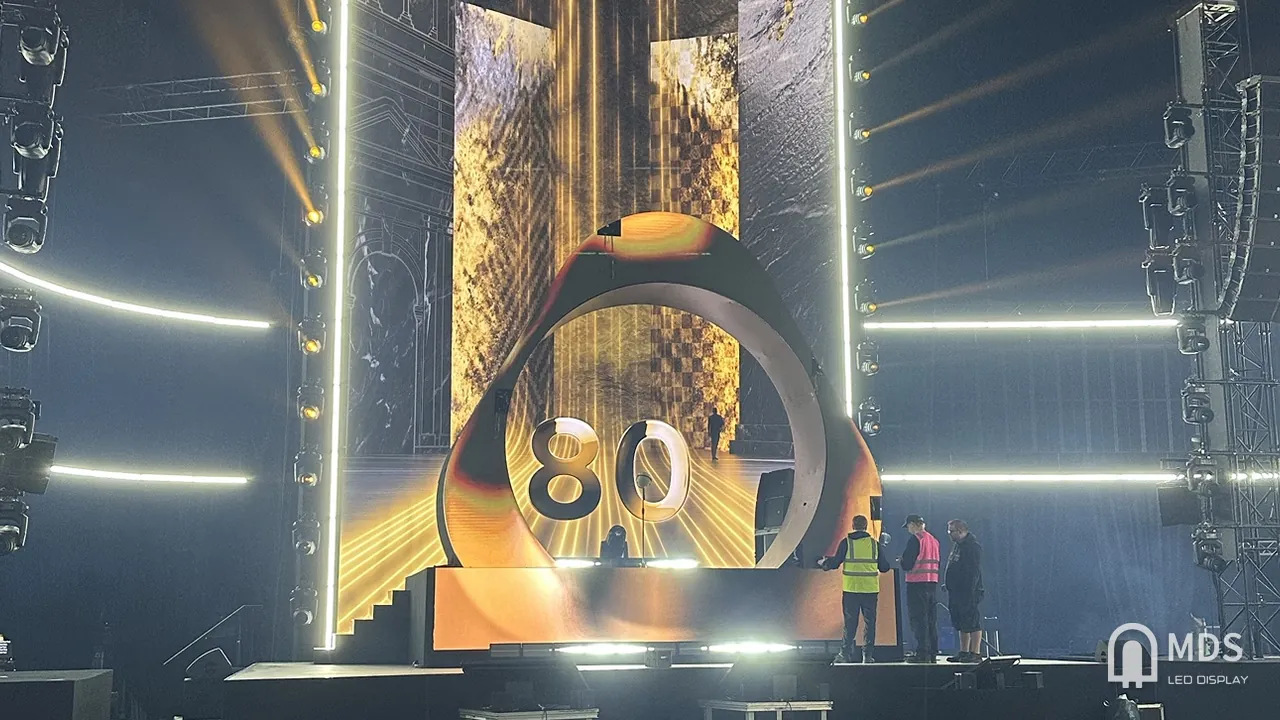 MDS curved P1.56 creative LED ring on an IQOS event stage, in front of a tall LED backdrop