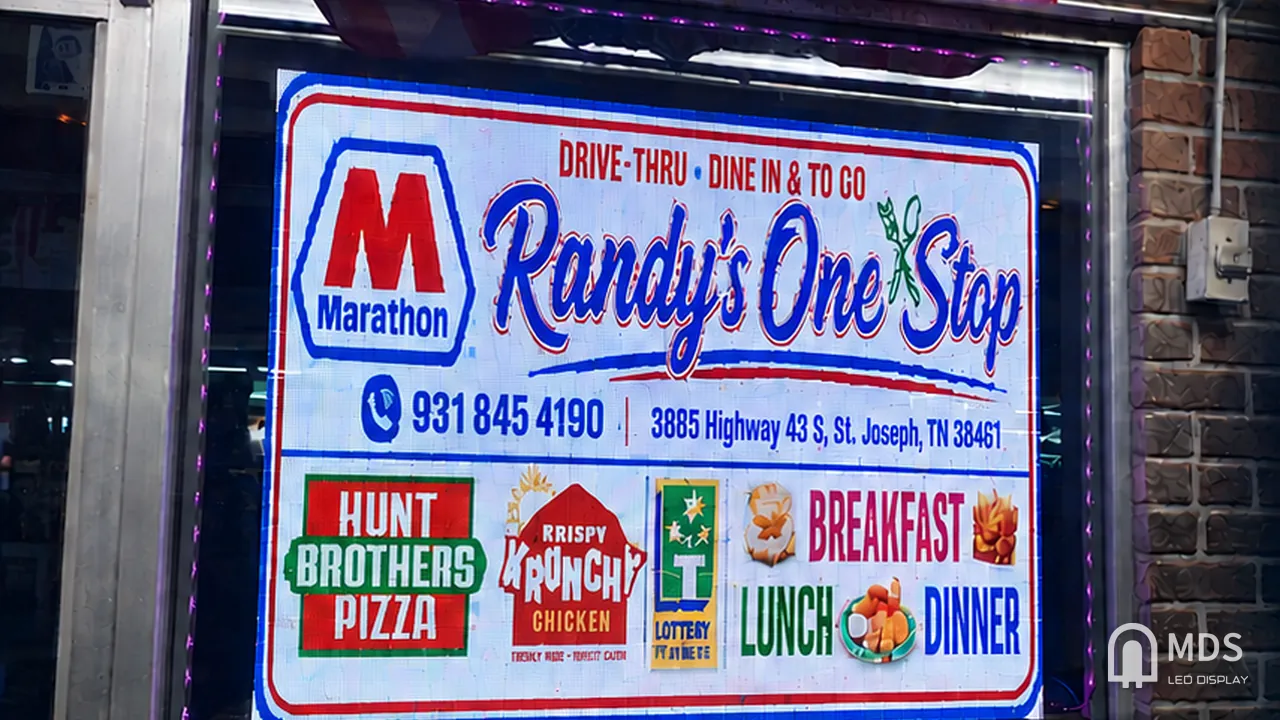 MDS transparent LED display in a convenience store window, Loretto, Tennessee, United States