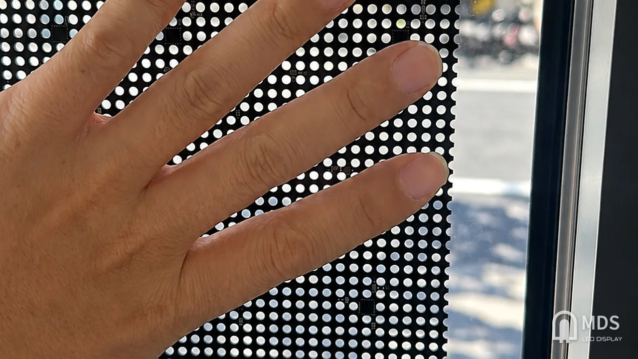 Perforated mesh PCB detail of the MDS Mesh PCB Transparent LED Display beside the glass, MARRYME by Ribas, Vilnius